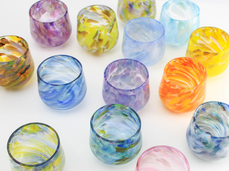 Colourful handblown glass cups with swirls